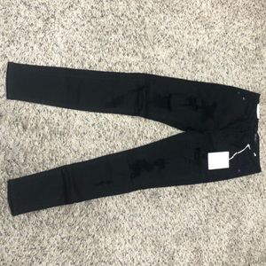 High rise black destroyed detail skinny jeans